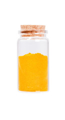Yellow curry powder in a glass bottle with cork stopper, isolate