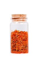 Saffron stamens in a glass bottle with cork stopper, isolated on
