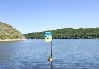 Flag on the background of the river