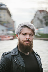 Bearded hipster with nose ring in leather jacket - 86371905