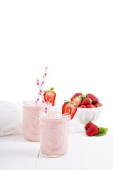Strawberry milkshake in mason jars