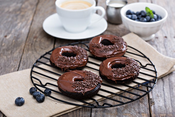 Chocolate donuts with coffee and blueberries