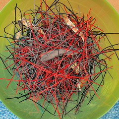 String remains which have been cut out of Tennis racquets in preparation of installation of a new fresh string on a stringing machine at a pro shop in Melbourne, Australia.