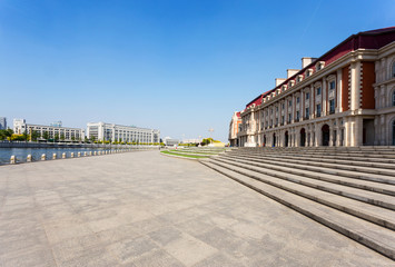 Obraz premium office building exterior with brick road floor