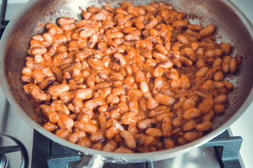 beans in tomato sauce on pan