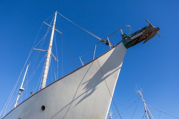 Fototapeta premium Part of big white ship moored in port