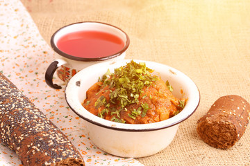 rural homemade lunch chicken braised in tomatoes French loaf of bread compote slow cooking
