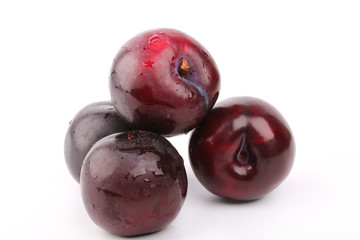 plum isolated on a white background juicy ripe red