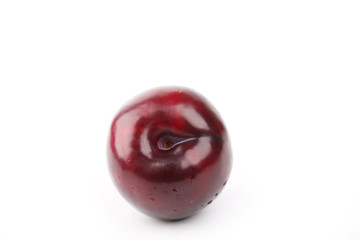plum isolated on a white background juicy ripe red
