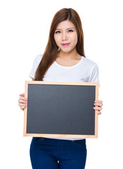 Woman showing the blank blackboard for presentation