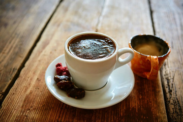 Cup of coffee on a wooden background