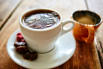 Cup of coffee on a wooden background