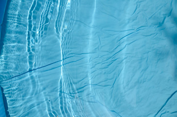 Fototapeta na wymiar Hot summer, texture of a plastic pool