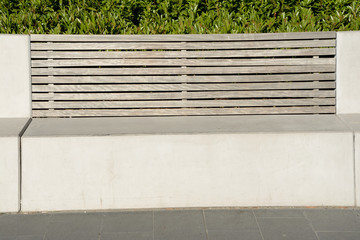 Concrete bench with wooden backrest