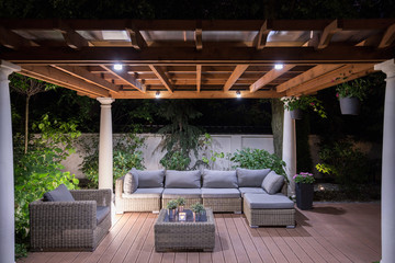 Arbour with comfortable garden furniture - Powered by Adobe