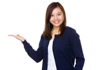 Asian woman showing the blank area for selling something