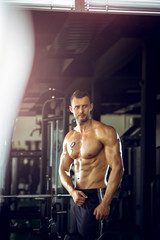 Fototapeta na wymiar Man posing in gym