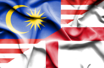 Waving flag of England and Malaysia