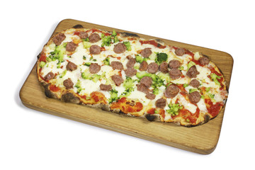 Pizza with sausage and broccoli on a wooden cutting board