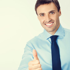 Businessman with thumbs up gesture