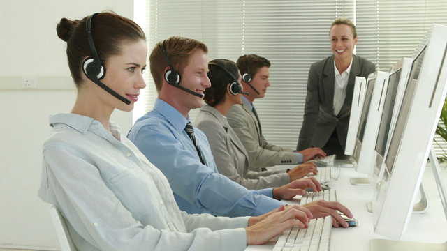 Business team working in call center 