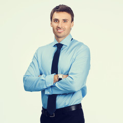 cheerful businessman in blue confident business wear