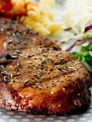 Grilled steaks and vegetable salad