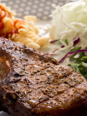Grilled steaks and vegetable salad