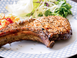 Grilled steaks and vegetable salad
