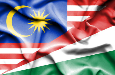 Waving flag of Seychelles and Malaysia