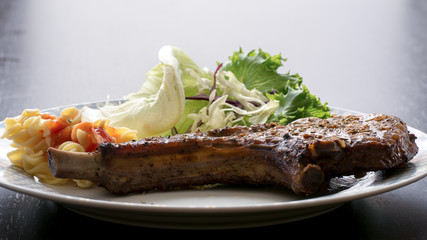 Grilled steaks and vegetable salad