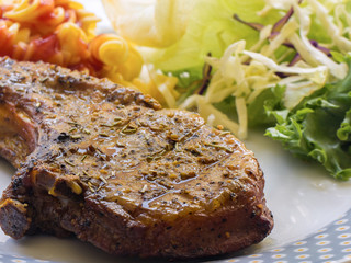 Grilled steaks and vegetable salad