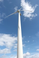 einzelnes Windrad an einem sonnigen Tag