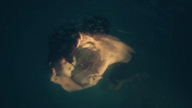 dip in the pool, underwater / man and woman fall in the pool, kiss under the water, couple in love