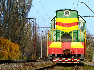 Multicolored locomotive taken closeup.View in front.
