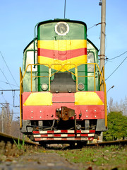 Fototapeta na wymiar Locomotive on rails view in front.