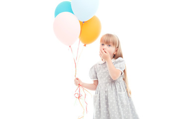 Pleasant girl holding balloons 