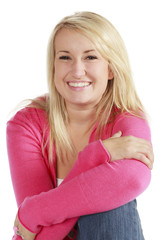Portrait of a young pretty blonde woman on a white background.