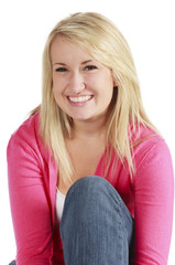 Portrait of a young pretty blonde woman on a white background.