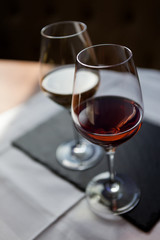 Closeup of two glasses of rose and white wine