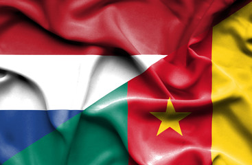 Waving flag of Cameroon and Netherlands