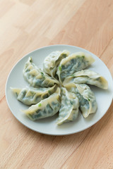 Chinese dumpling on white plate