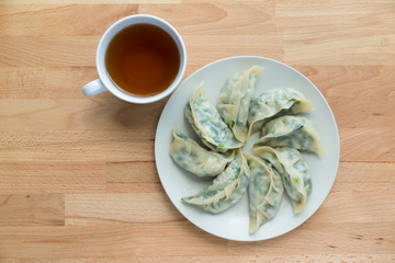 Meat dumpling with a cup of tea