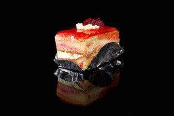 Strawberry cake on black background