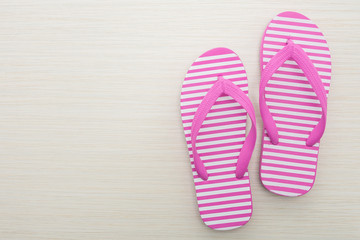 Flip flop on wooden background