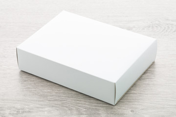 Paper box on wood background