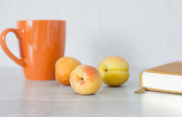 Summer set: apricots, cup, book