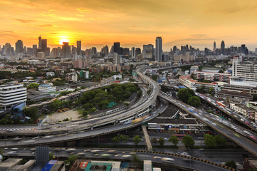 Bangkok city at sunset and main traffic high way, office building
