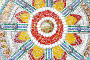 the colorful broken tile, bead, bowl and stone decorating on tem