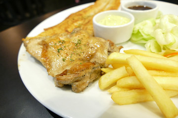 fish steak and grilled chicken with sauce